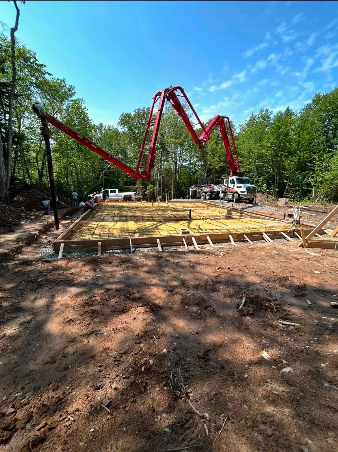 Concrete pump truck pouring a slab