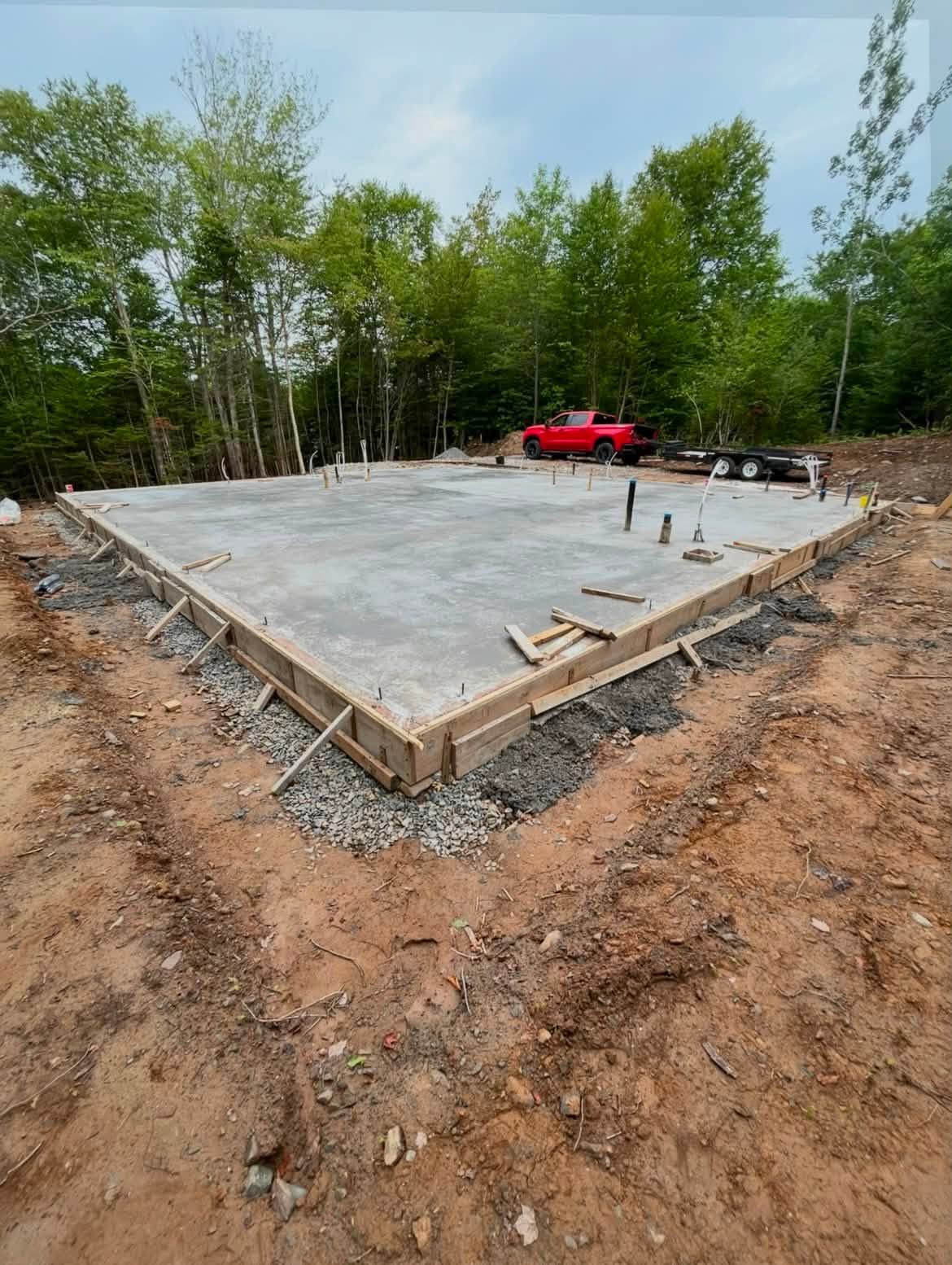Finished concrete house slab with truck